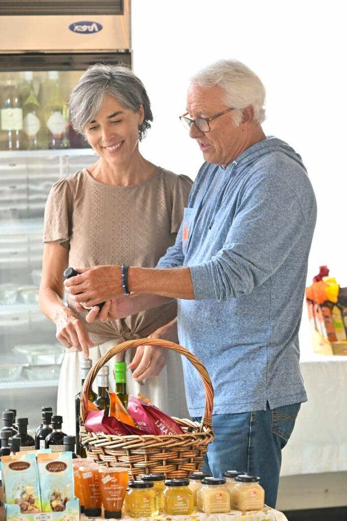 man and woman shopping at market